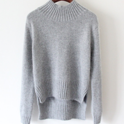Knitted Mock Neck Sweater Featuring High Low Hem..
