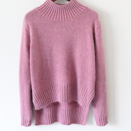 Knitted Mock Neck Sweater Featuring High Low Hem..