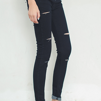 Black waist jeans female knee holes..