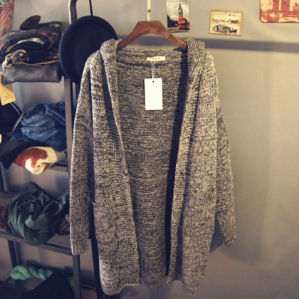 In The Long Section Of Gray Hooded Sweater Coat